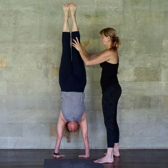 erika helping student teacher do a handstand